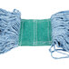 A close-up of a blue yarn mop head with white stitching and a green net.