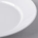A close-up of a Libbey Royal Rideau white porcelain bowl with a white rim.