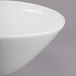 A close-up of a Libbey Royal Rideau white porcelain bowl with a small rim.