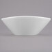 A white Libbey porcelain bowl with a small rim.