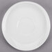 A white Libbey porcelain saucer with a small circle on the rim.