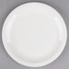 A white Libbey narrow rim porcelain plate on a gray surface.