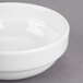 A close-up of a Libbey Royal Rideau white porcelain fruit bowl.