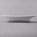 A close up of a Libbey Royal Rideau white square porcelain deep rimmed soup bowl.