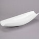A white Libbey Royal Rideau porcelain canoe plate on a gray surface.