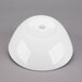 A Libbey Royal Rideau white round porcelain bowl on a gray surface.
