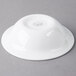 A Libbey Royal Rideau white porcelain bowl on a gray surface.