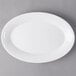 A white oval Libbey porcelain platter on a gray background.