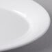A close-up of a white Libbey Royal Rideau porcelain platter with a white rim.
