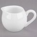 A white Libbey porcelain creamer with a handle.