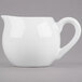 A white Libbey porcelain creamer with a handle.
