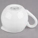A white porcelain Libbey creamer with a handle.