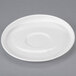 A white Libbey round porcelain saucer with a round center on a gray surface.