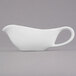 A Libbey Royal Rideau white porcelain sauce boat on a white background.