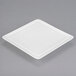 A white Libbey square porcelain plate.