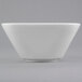 A close up of a white Libbey Slenda square porcelain bowl with a small rim.