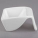 A white square porcelain bowl with a curved edge.