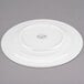 A white Libbey round porcelain plate with a wide rim.