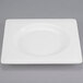 A white Libbey porcelain plate with a wide square white border.