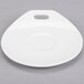 A white porcelain saucer with a circular edge.