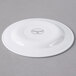 A Libbey round white porcelain plate with a medium rim.