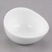 A white Libbey porcelain sauce bowl with a small hole in it.