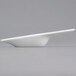 A Libbey white porcelain amuse bouche spoon with a curved bowl and long handle.