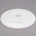 A white Libbey porcelain plate with a wide, circular rim.