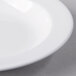 A Libbey Royal Rideau white porcelain deep rimmed soup bowl with a white rim.