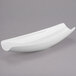 A white Libbey Royal Rideau porcelain canoe plate with a curved edge on a gray surface.