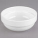 A white Libbey stacking bowl on a gray surface.