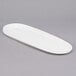 A white oval porcelain tray with a handle.