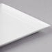 A white rectangular porcelain tray with a small edge.