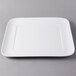 A white square Libbey porcelain tray with a white rim.