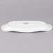 A white rectangular Libbey porcelain tray with a fluted edge and a logo.