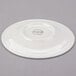 A white Royal Rideau porcelain tea saucer with a circular design on the edge.