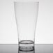 A clear Fineline plastic beer/pilsner glass on a table.