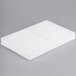 A white rectangular Martellato polycarbonate tray with 22 stick decorations.