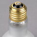 A Satco R20 incandescent light bulb with a gold cap.