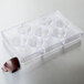 A clear plastic Martellato chocolate mold with 7 espresso cup compartments.
