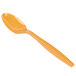 A close-up of a Creative Converting Pumpkin Spice orange plastic spoon.