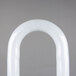 A white plastic arch with curved ends.