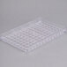 A clear plastic Matfer Bourgeat chocolate mold tray with 104 compartments.