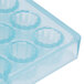 A clear plastic Matfer Bourgeat chocolate mold with 40 small compartments.