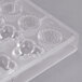 A clear plastic Matfer Bourgeat chocolate mold with 24 compartments.