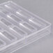 A clear plastic polycarbonate tray for making 24 bullion chocolates.
