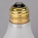 A Satco 40 Watt frosted incandescent light bulb with a gold and black cap.