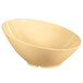 A beige slanted melamine bowl with a squash design.