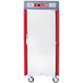 A silver Metro insulated holding cabinet with red details on the door.