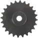 A close-up of a black gear with a hole in the middle.